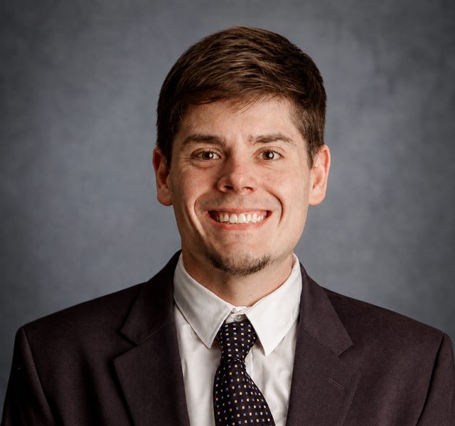 Professional portrait of Christopher Naylor.